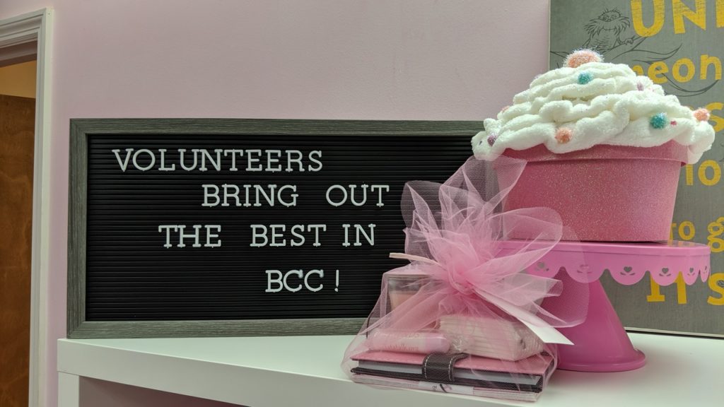 gift basket on counter by sign that says [Volunteers bring out the best in BCC!]